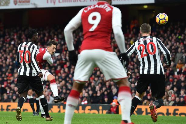 Unai Emery explains why Mesut Ozil will start against Newcastle 2 Arsenal's German midfielder Mesut Ozil (2nd L) shoots to score the opening goal of the English Premier League football match between Arsenal and Newcastle United at the Emirates Stadium in London on December 16, 2017. / AFP PHOTO / Glyn KIRK
