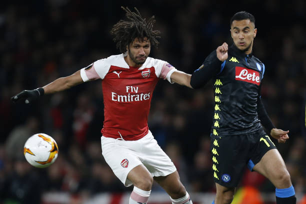 Napoli and Emirates Cup: Latest on Arsenal pre-season plans 2 Arsenal's Egyptian midfielder Mohamed Elneny (L) vies with Napoli's French-born Algerian midfielder Adam Ounas during the UEFA Europa League quarter final, first leg, football match between Arsenal and Napoli at the Emirates Stadium in London on April 11, 2019. (Photo by Ian KINGTON / IKIMAGES / AFP)