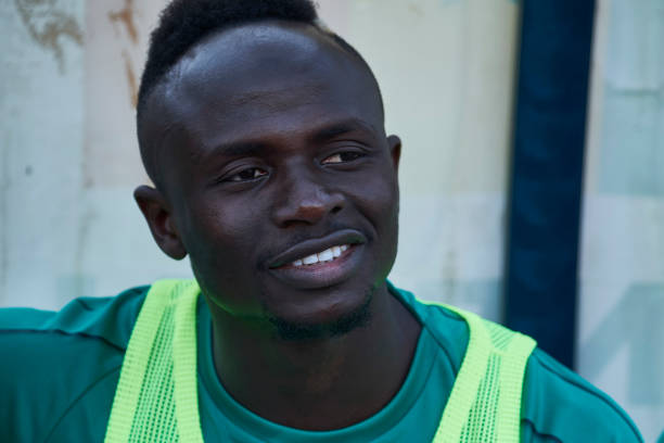 DAKAR, SENEGAL - MARCH 26: Sadio Mane looks on as he sits in the bench ahead of a friendly match between Senegal and Mali after both teams qualifie...