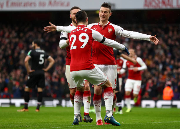 LONDON, ENGLAND - JANUARY 20: Laurent Koscielny of Arsenal celebrates scoring his side's third goalwith Granit Xhaka during the Premier League matc...