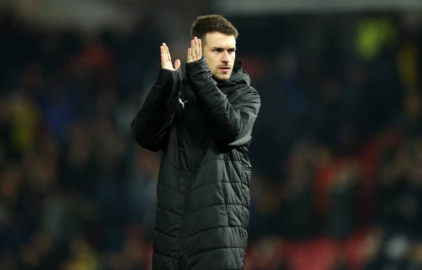 WATFORD, ENGLAND - APRIL 15: Aaron Ramsey of Arsenal applauds the fans following the Premier League match between Watford FC and Arsenal FC at Vica...