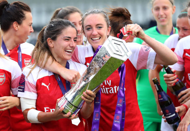 Arsenal release 2 at end of contracts 2 BOREHAMWOOD, ENGLAND - MAY 11: Danielle Van de Donk and Lisa Evans of Arsenal celebrate with the trophy after the WSL match between Arsenal Women and Manchester City at Meadow Park on May 11, 2019 in Borehamwood, England. (Photo by Catherine Ivill/Getty Images)