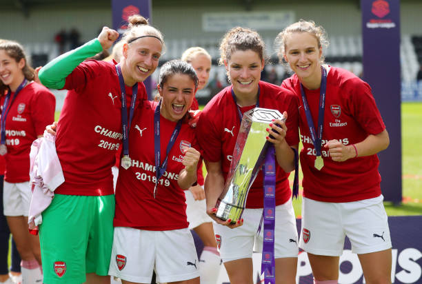 BOREHAMWOOD, ENGLAND - MAY 11: Sari Van Veenendaal, Danielle Van de Donk, Dominique Bloodworth and Vivianne Miedema of Arsenal celebrate with the t...