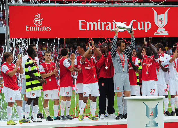 LONDON, ENGLAND - AUGUST 01: Captain Manuel Almunia of Arsenal lifts the winners' trophy after the Emirates Cup match between Arsenal and Celtic at...