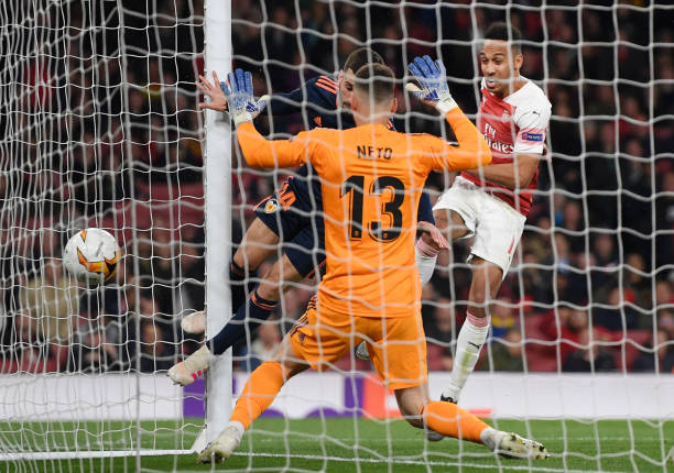 LONDON, ENGLAND - MAY 02: Pierre-Emerick Aubameyang of Arsenal scores his team's third goal past Jose Luis Gaya and Norberto Murara Neto of Valenci...