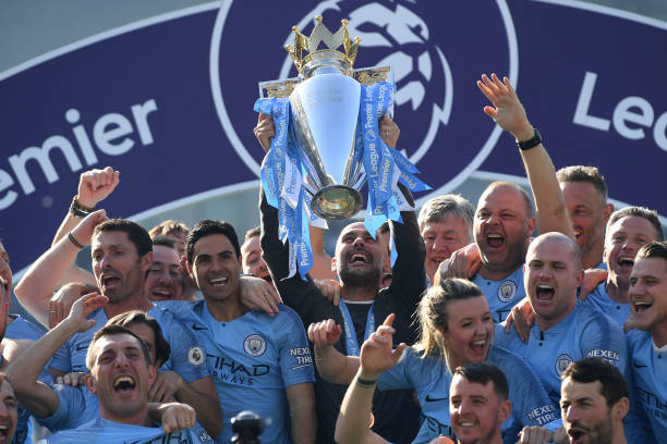 What are Arsenal's top four chances? A look at the teams above 5 BRIGHTON, ENGLAND - MAY 12: Manchester City manager Pep Guardiola holds the winner's trophy aloft after the Premier League match between Brighton & Hove Albion and Manchester City at American Express Community Stadium on May 12, 2019 in Brighton, United Kingdom. (Photo by Mike Hewitt/Getty Images)