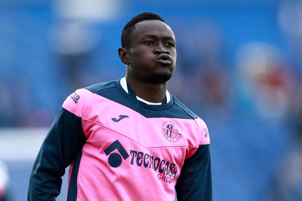Getafe's Togolese defender Djene Dakonam warms up before the Spanish League football match between Getafe and Sevilla at the Coliseum Alfonso Perez...