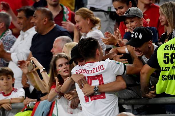 Hungary's midfielder Dominik Szoboszlai celebrates his team's victory over Wales with supporters after the UEFA Euro 2020 qualifier Group E footbal...