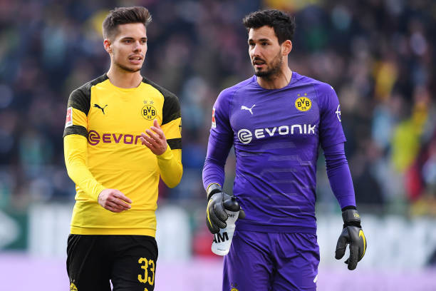 BREMEN, GERMANY - MAY 04: (L-R) Julian Weigl and Roman Buerki of Borussia Dortmund speaks during the Bundesliga match between SV Werder Bremen and ...