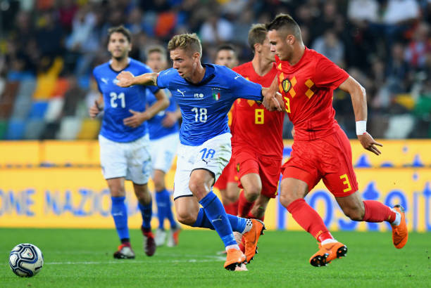 UDINE, ITALY - OCTOBER 11: Luca Vido of Italy U21 competes for the ball with Zinho Vanheusden (R) of Belgium U21 during the International Friendly ...