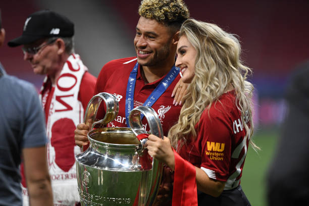 Position change might not save Oxlade-Chamberlain at Liverpool, West Ham keen 2 MADRID, SPAIN - JUNE 01: Alex Oxlade-Chamberlain of Liverpool celebrates with his girlfriend Perrie Edwards after his side won during the UEFA Champions League Final between Tottenham Hotspur and Liverpool at Estadio Wanda Metropolitano on June 01, 2019 in Madrid, Spain. (Photo by Michael Regan/Getty Images)