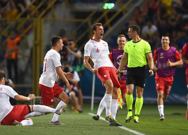 BOLOGNA, ITALY - JUNE 19: Krystian Bielik of Poland celebrates after scoring the opening goal during the 2019 UEFA U-21 Group A match between Italy...