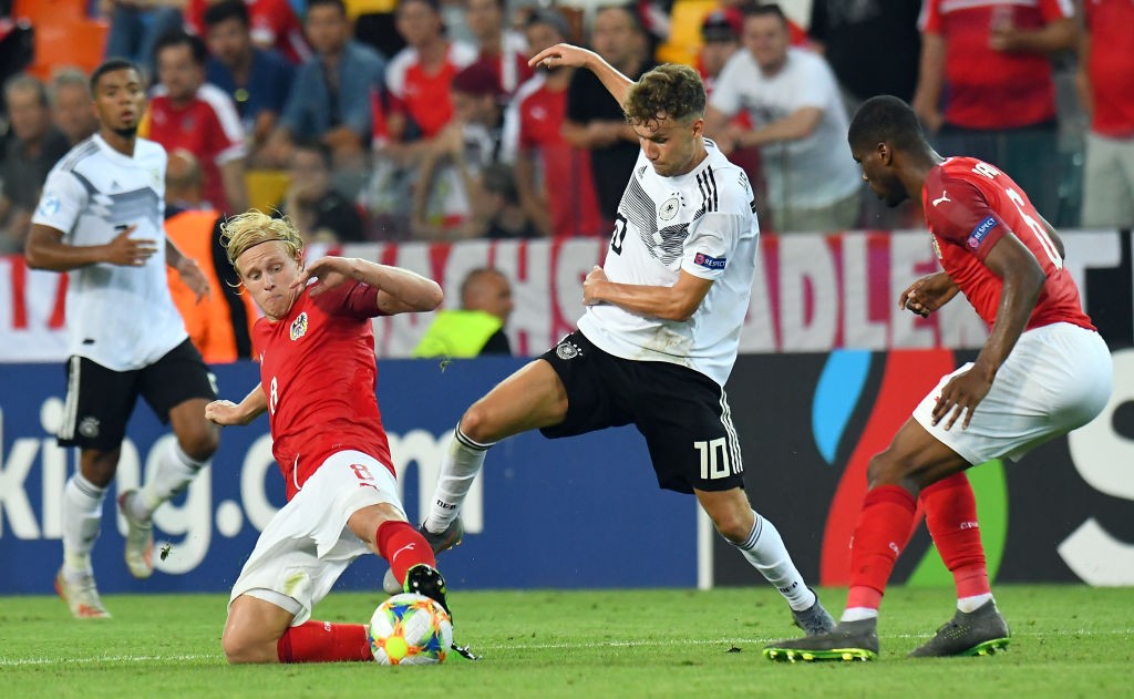 UDINE, ITALY - JUNE 23: Luca Waldschmidt of Germany competes for the ball with Xaver Schlager of Austria during the 2019 UEFA U-21 Group B match be...