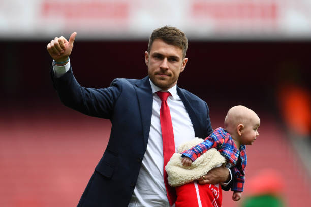 Arsenal enter 2019/20 season with just 1 senior player in final year of his contract 3 LONDON, ENGLAND - MAY 05: Aaron Ramsey of Arsenal, holding one of his children, acknowledges the crowd as he says farewell to the club following the Premier League match between Arsenal FC and Brighton & Hove Albion at Emirates Stadium on May 05, 2019 in London, United Kingdom. (Photo by Clive Mason/Getty Images)