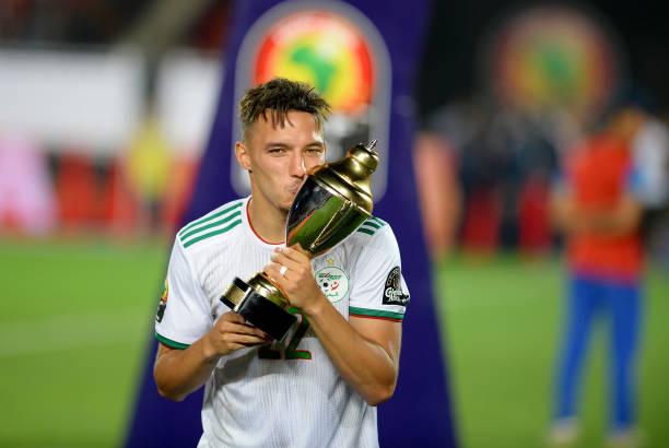 Arsenal to receive £4.35m from Empoli for Ismael Bennacer's AC Milan move 3 Algeria's midfielder Ismail Bennacer (2nd-L) celebrates the trophy of best young player after winning the 2019 Africa Cup of Nations (CAN) Final football match between Senegal and Algeria at the Cairo International Stadium in Cairo on July 19, 2019. (Photo by MOHAMED EL-SHAHED / AFP)