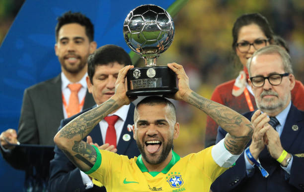 Good news as Arsenal won't be signing Dani Alves on free transfer 2 RIO DE JANEIRO, BRAZIL - JULY 07: Dani Alves of Brazil poses with the trophy of Best Player of the tournament after winning the Copa America Brazil 2019 Final match between Brazil and Peru at Maracana Stadium on July 07, 2019 in Rio de Janeiro, Brazil. (Photo by Buda Mendes/Getty Images)
