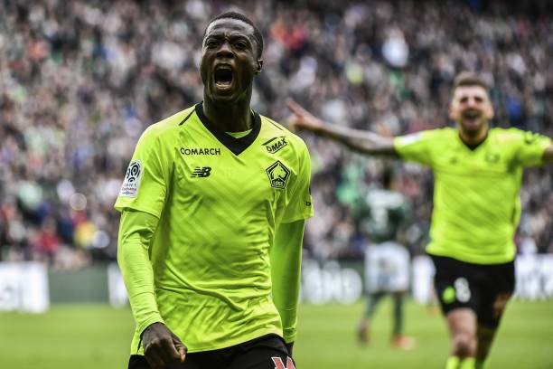 Lille's Ivorian forward Nicolas Pepe celebrates after scoring a goal during the L1 football match AS Saint-Etienne (ASSE) vs Lille (LOSC) on March 10, 2019, at the Geoffroy Guichard Stadium in Saint-Etienne, central France. (Photo by JEFF PACHOUD / AFP)