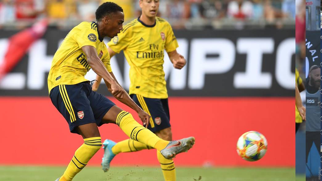 Joe Willock scoring against Fiorentina in pre-season (Photo via Arsenal.com)