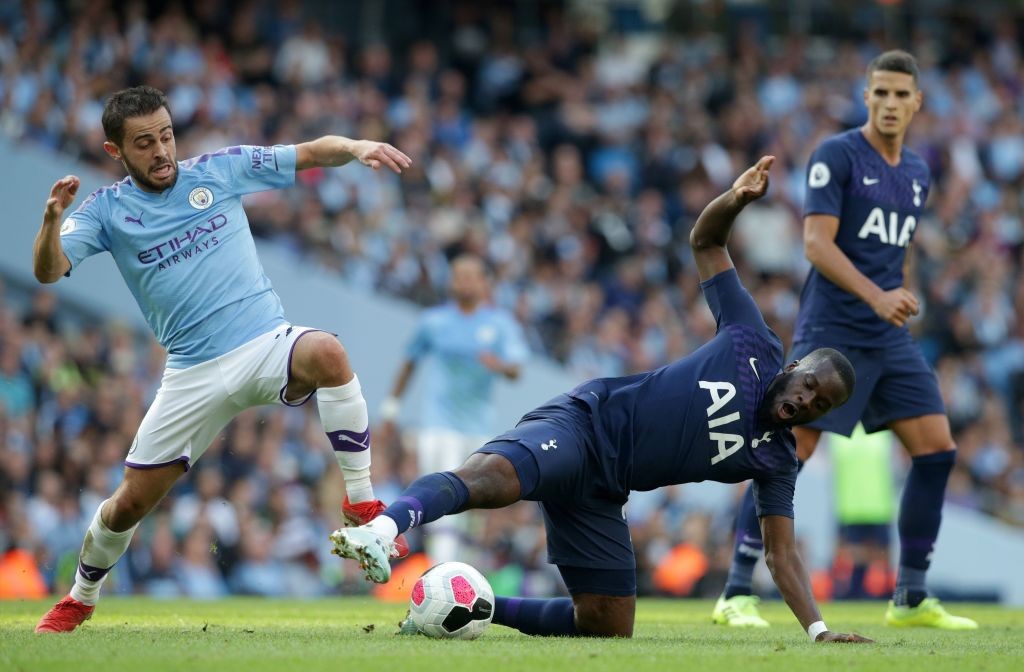 Manchester City's Portuguese midfielder Bernardo Silva (L) vies with Tottenham Hotspur's French midfielder Tanguy Ndombele during the English Premi...