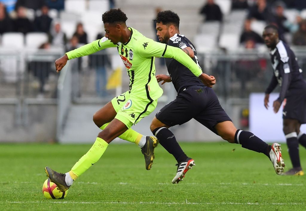 Angers' French midfielder Jeff Reine-Adelaide (L) vies with Bordeaux' Brazilian midfielder Otavio during the French L1 football match between Borde...