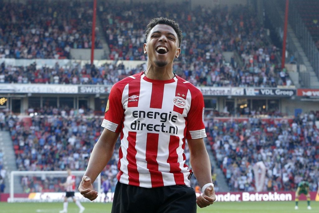 PSV Eindhoven's Dutch forward Donyell Malen celebrates after scoring a goal during the Dutch Eredivisie match between PSV Eindhoven and ADO den Haa...
