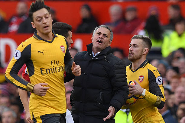 Manchester United's Portuguese manager Jose Mourinho (C) reacts after Arsenal's Spanish defender Nacho Monreal challenged Manchester United's Ecuad...