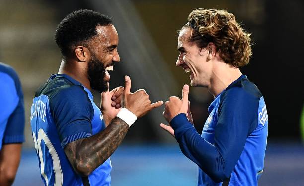 France's forward Antoine Griezmann (R) celebrates his goal with France's forward Alexandre Lacazette (L) during the friendly football match France ...