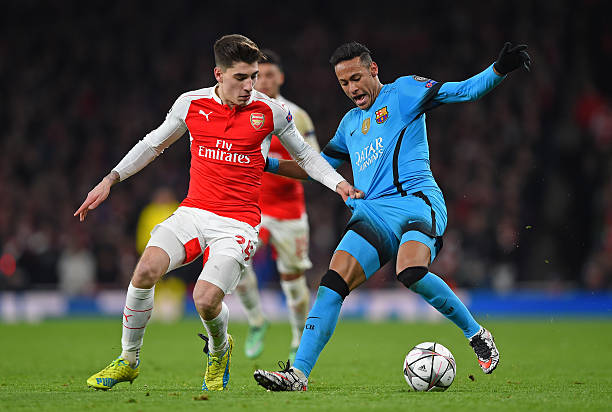 LONDON, ENGLAND - FEBRUARY 23: Neymar of Barcelona is challenged by Hector Bellerin of Arsenal during the UEFA Champions League round of 16, first ...