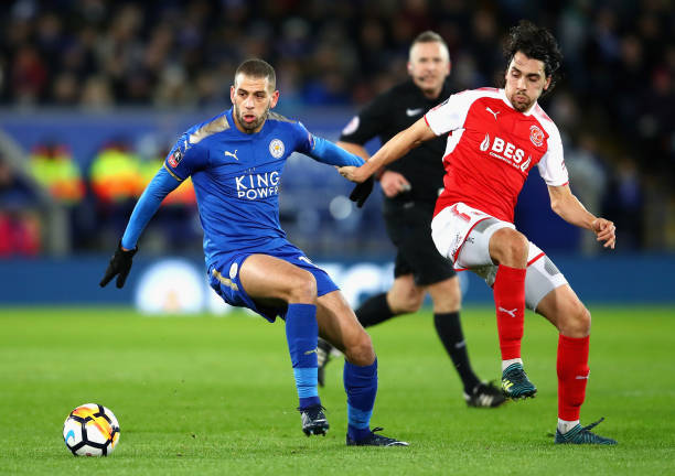 LEICESTER, ENGLAND - JANUARY 16:  Islam Slimani of Leicester City evades Markus Schwabl of Fleetwood Town during The Emirates FA Cup Third Round Replay match between Leicester City and Fleetwood Town at The King Power Stadium on January 16, 2018 in Leicester, England.  (Photo by Julian Finney/Getty Images )