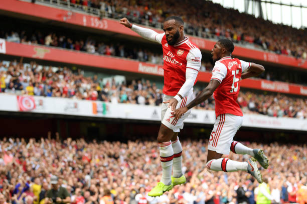 LONDON, ENGLAND - AUGUST 17: Alexandre Lacazette of Arsenal celebrates after scoring his team's first goal with Ainsley Maitland-Niles during the Premier League match between Arsenal FC and Burnley FC at Emirates Stadium on August 17, 2019 in London, United Kingdom. (Photo by Michael Regan/Getty Images)