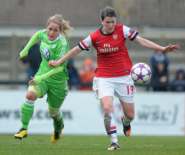 BOREHAMWOOD, ENGLAND - APRIL 14: Niamh Fahey (R) of Arsenal holds off Anna Blasse of Wolfsburg during the UEFA Women's Champions League Semi Final ...