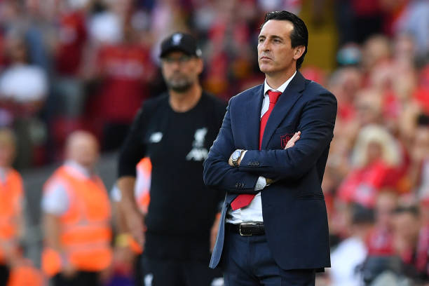 Arsenal's Spanish head coach Unai Emery (R) looks on during the English Premier League football match between Liverpool and Arsenal at Anfield in L...