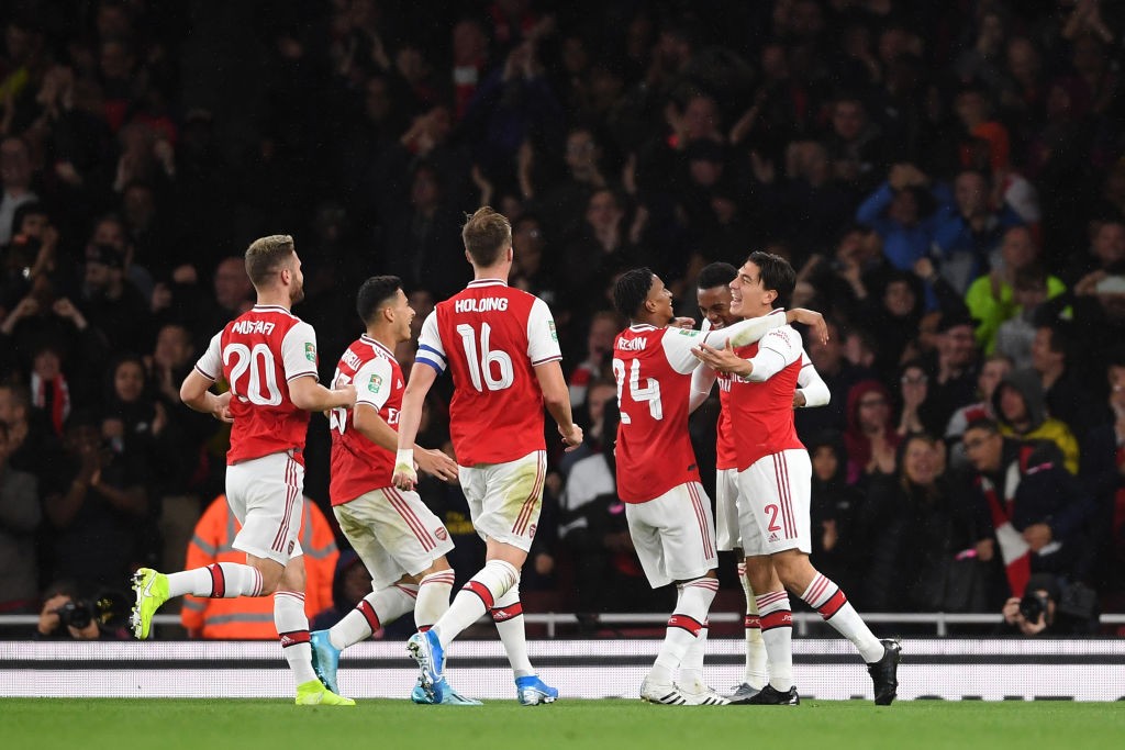 LONDON, ENGLAND - SEPTEMBER 24: Joe Willock of Arsenal celebrates scoring his teams third goal of the game with team mate Hector Bellerin during th...