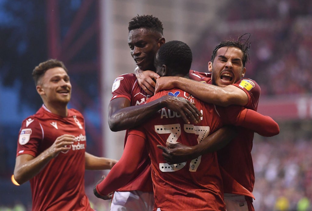 NOTTINGHAM, ENGLAND - AUGUST 27: Albert Adomah of Nottingham Forest celebrates scoring the opening goal with Alfa Semedo and Yuri Ribeiro during th...
