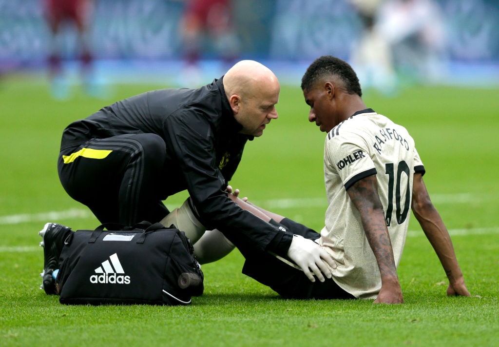 LONDON, ENGLAND - SEPTEMBER 22: An injured Marcus Rashford of Manchester United during the Premier League match between West Ham United and Manches...