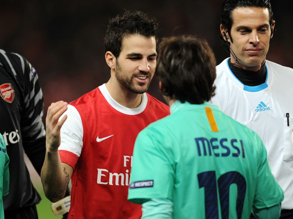Arsenal's Spanish midfielder Cesc Fabregas (L) greets Barcelona's Argentine striker Lionel Messi (R) before their UEFA Champions League round of 16, 1st leg football match against Barcelona at the Emirates Stadium, London, England, on February 16, 2011. AFP PHOTO/ADRIAN DENNIS