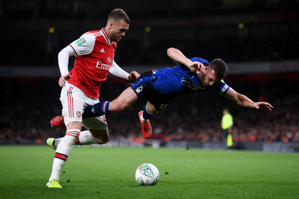 LONDON, ENGLAND - SEPTEMBER 24: Calum Chambers of Arsenal battles for the ball with Jack Robinson of Nottingham Forest during the Carabao Cup Third...