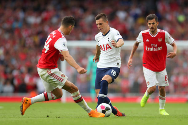 Unai Emery and Granit Xhaka cost Arsenal 2 points against Tottenham 2 LONDON, ENGLAND - SEPTEMBER 01: Giovani Lo Celso of Tottenham Hotspur is challenged by Granit Xhaka of Arsenal during the Premier League match between Arsenal FC and Tottenham Hotspur at Emirates Stadium on September 01, 2019 in London, United Kingdom. (Photo by Catherine Ivill/Getty Images)