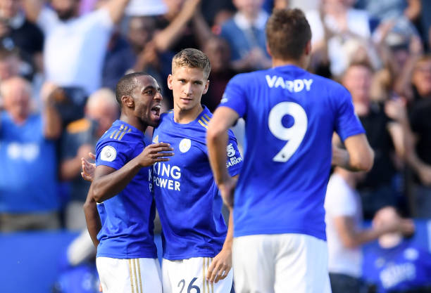 LEICESTER, ENGLAND - SEPTEMBER 21: Ricardo Pereira of Leicester City (L) celebrates after scoring his team's first goal with team mate Dennis Praet...