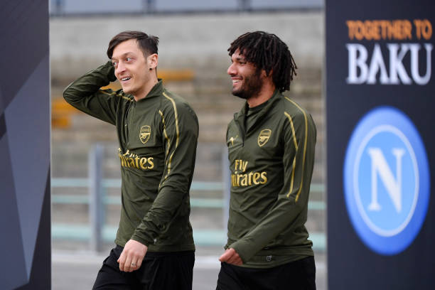 NAPLES, ITALY - APRIL 17: Mesut Ozil and Mohamed Elneny of Arsenal looks on during an Arsenal training session ahead of their UEFA Europa League qu...
