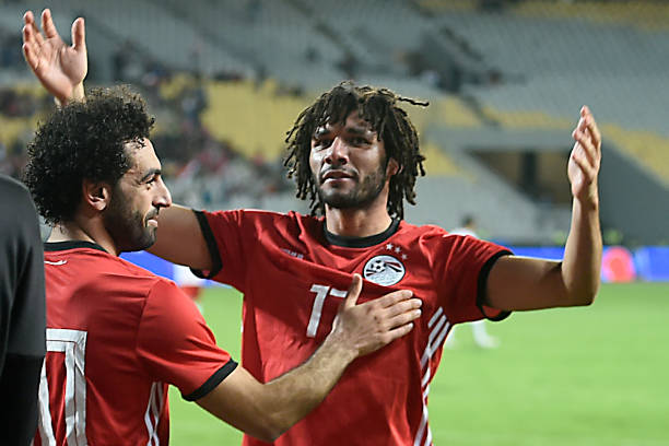 Egypt's midfielder Mohamed Elneny (R) celebrates with Egypt's forward Mohamed Salah (L) after one of their teammate scored a goal during the Africa...