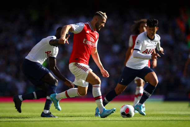 Schalke tried to re-sign Sead Kolasinac before the window closed 2 LONDON, ENGLAND - SEPTEMBER 01: Sead Kolasinac of Arsenal runs with the ball while pressured by Heung-Min Son of Tottenham Hotspur during the Premier League match between Arsenal FC and Tottenham Hotspur at Emirates Stadium on September 01, 2019 in London, United Kingdom. (Photo by Julian Finney/Getty Images)