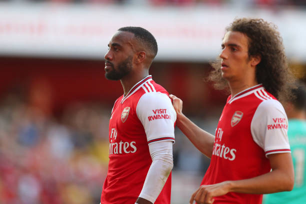 LONDON, ENGLAND - SEPTEMBER 01: Alexandre Lacazette of Arsenal celebrates scoring his team's first goal with team mate Matteo Guendouzi of Arsenal ...