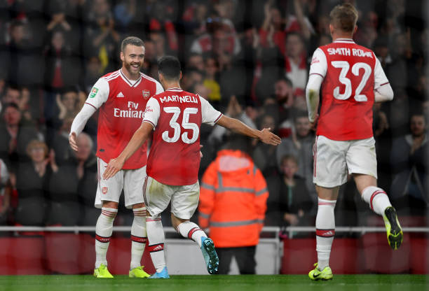 LONDON, ENGLAND - SEPTEMBER 24: Gabriel Martinelli of Arsenal celebrates scoring his teams first goal of the game with Calum Chambers, Emile Smith ...
