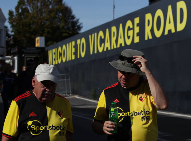 WATFORD, ENGLAND - SEPTEMBER 15: Watford fans walk outside the stadium prior to the Premier League match between Watford FC and Arsenal FC at Vicar...
