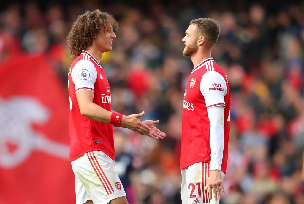 LONDON, ENGLAND - OCTOBER 06: David Luiz of Arsenal with Calum Chambers of Arsenal at the end of the Premier League match between Arsenal FC and AF...