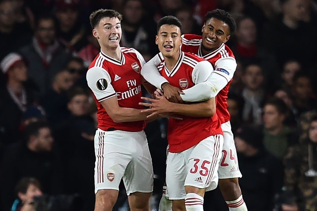 Arsenal's Brazilian striker Gabriel Martinelli (C) celebrates with teammates after scoring his second goal during the UEFA Europa League Group F football match between Arsenal and Standard Liege at the Arsenal Stadium in London on October 3, 2019. (Photo by GLYN KIRK/AFP via Getty Images)
