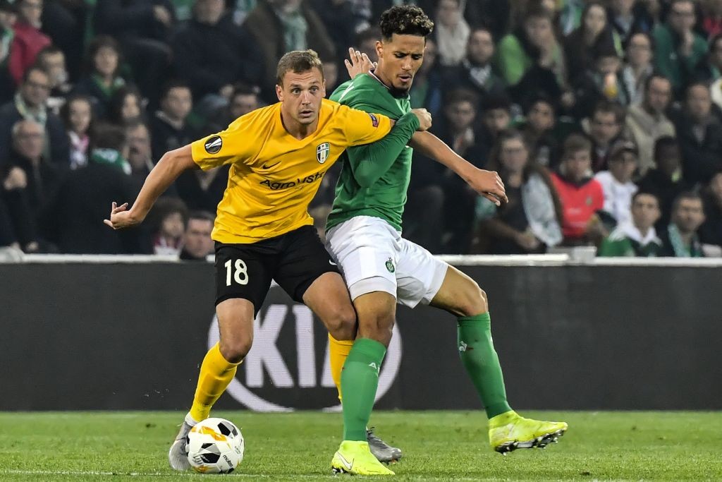 Oleksandria's Ukranian forward Artem Sitalo (L) fights for the ball with Saint-Etienne's French defender William Saliba (R) during the Europa Leagu...