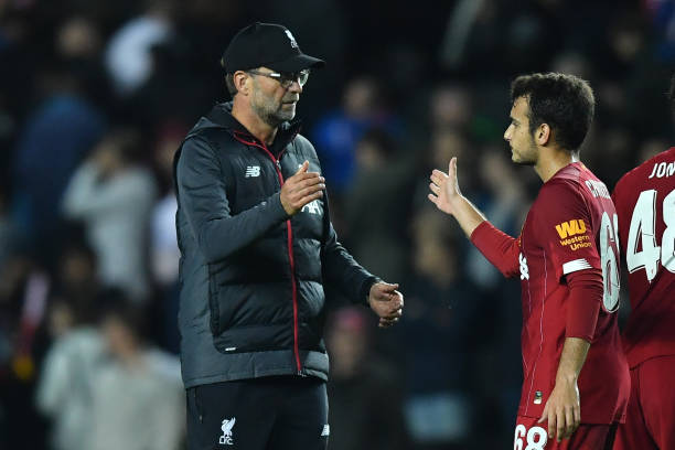 Liverpool's German manager Jurgen Klopp (L) reacts with Liverpool's Spanish midfielder Pedro Chirivella at the final whistle during the English Lea...