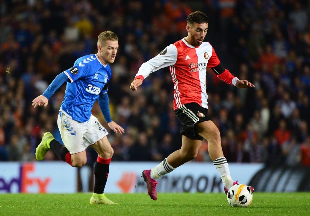 GLASGOW, SCOTLAND - SEPTEMBER 19: Orkun Kokcu of Feyenoord runs past Steven Davis of Rangers FC during the UEFA Europa League group G match between Rangers FC and Feyenoord at Ibrox Stadium on September 19, 2019, in Glasgow, United Kingdom. (Photo by Mark Runnacles/Getty Images)